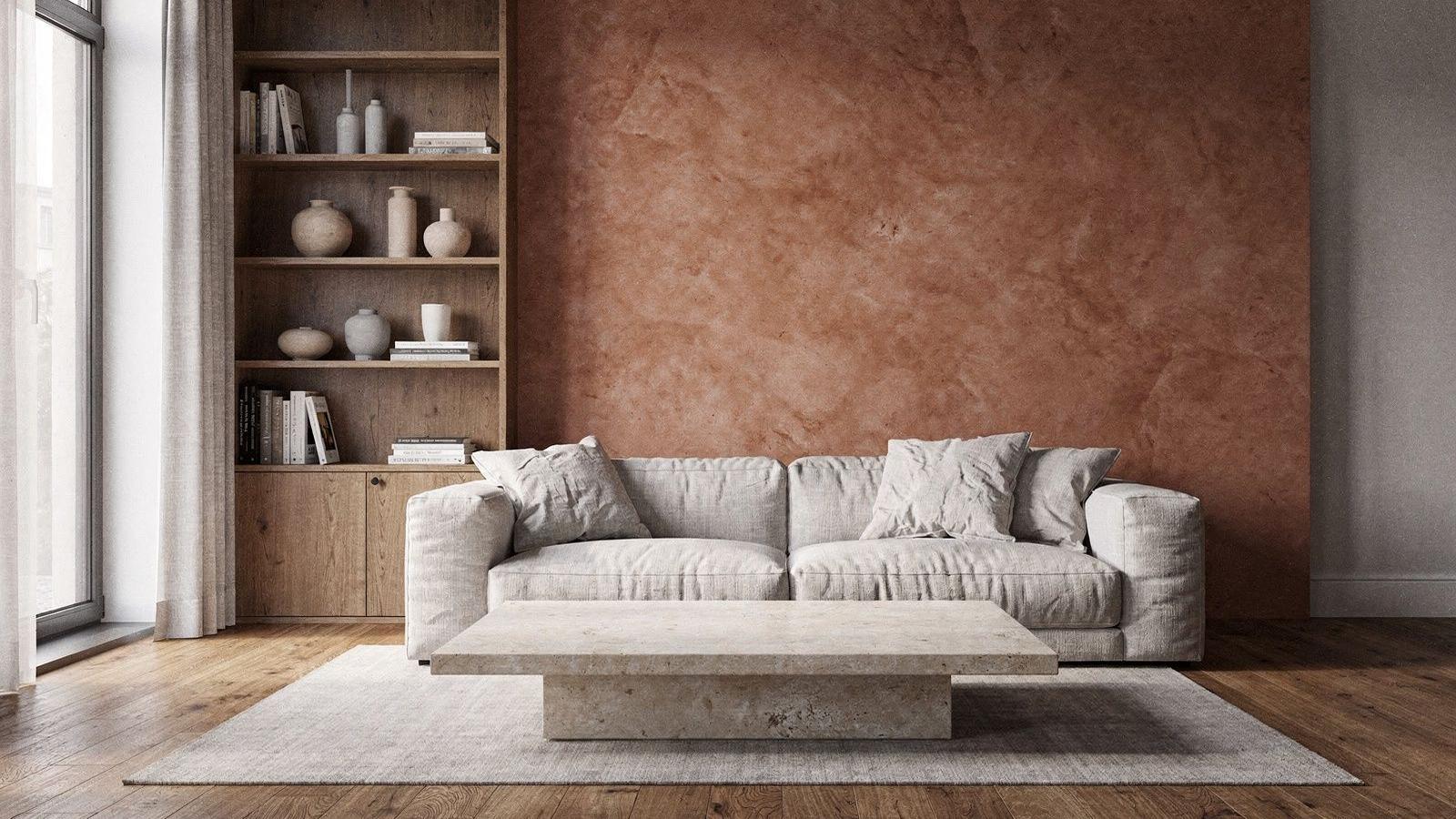 Completed living room with clay plaster wall, oak shelving and pale stone table after renovation